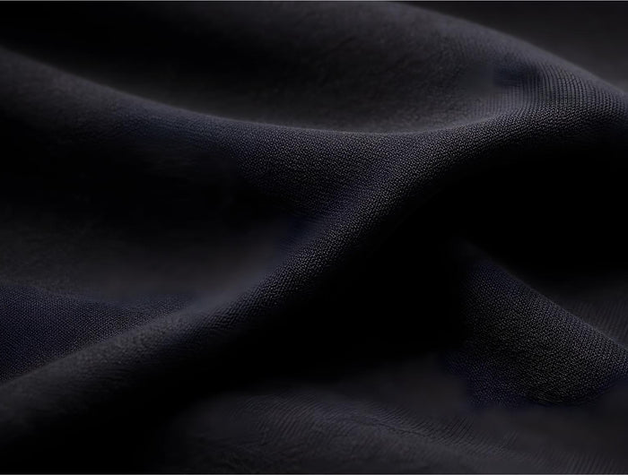 Dark blue fabric texture with folds